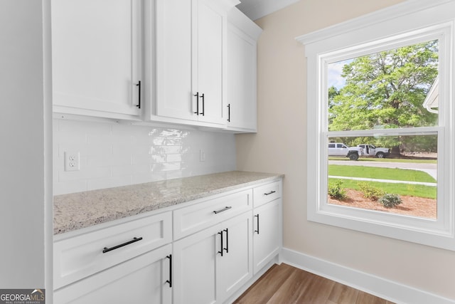 88 Northshore Ave, Jesup, GA 31545 - bar featuring baseboards, tasteful backsplash, and wood finished floors
