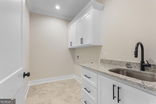 88 Northshore Ave, Jesup, GA 31545 - clothes washing area with cabinet space, washer hookup, baseboards, and a sink