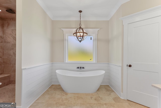 88 Northshore Ave, Jesup, GA 31545 - full bath featuring tiled shower, wainscoting, a notable chandelier, a freestanding tub, and crown molding