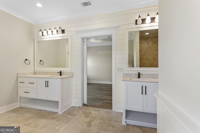 88 Northshore Ave, Jesup, GA 31545 - bathroom with two vanities, visible vents, baseboards, and a sink