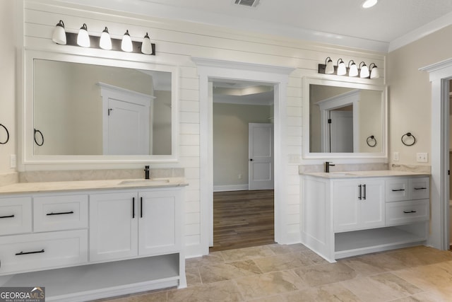 88 Northshore Ave, Jesup, GA 31545 - bathroom with two vanities, visible vents, baseboards, and a sink