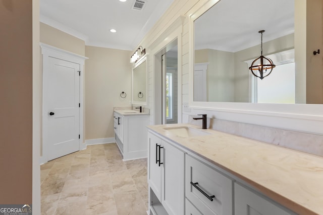 88 Northshore Ave, Jesup, GA 31545 - full bath featuring a chandelier, two vanities, visible vents, and a sink