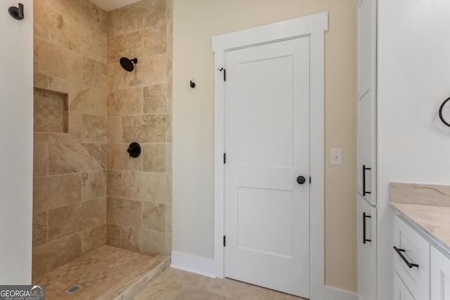 88 Northshore Ave, Jesup, GA 31545 - bathroom featuring baseboards, vanity, and a tile shower