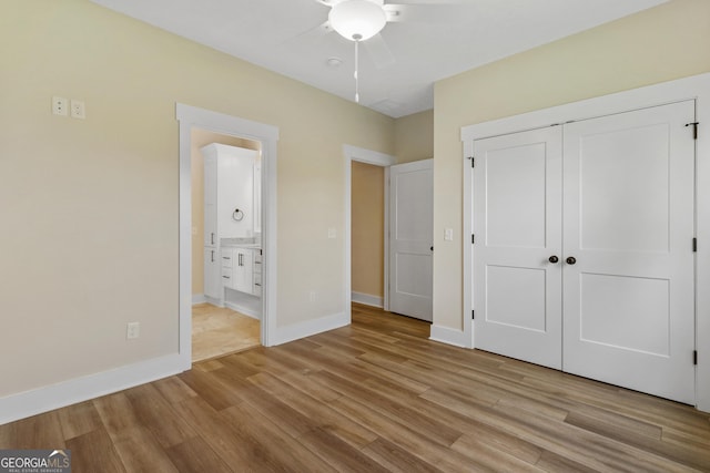 88 Northshore Ave, Jesup, GA 31545 - unfurnished bedroom with ensuite bath, light wood-type flooring, a closet, and baseboards