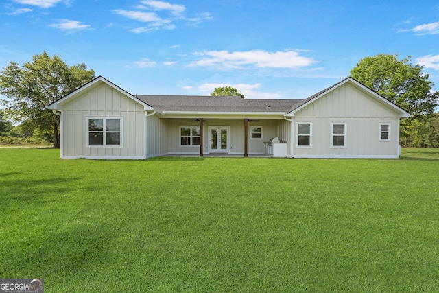 88 Northshore Ave, Jesup, GA 31545 - rear view of house featuring a yard, a ceiling fan, board and batten siding, and french doors
