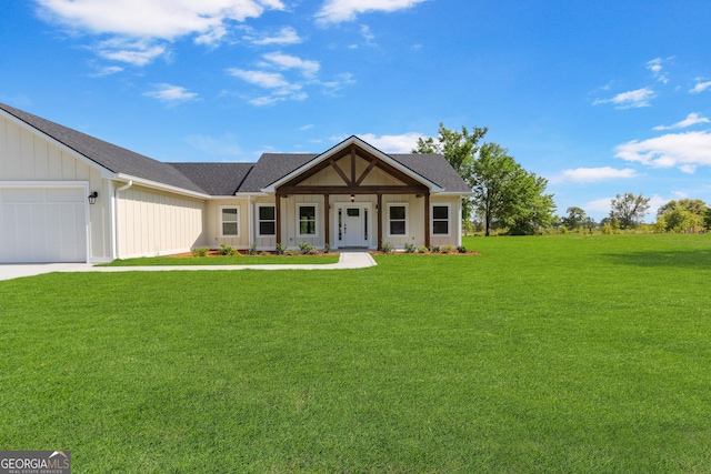 88 Northshore Ave, Jesup, GA 31545 - modern farmhouse style home with a shingled roof, a front lawn, concrete driveway, board and batten siding, and a garage