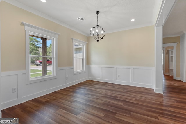 88 Northshore Ave, Jesup, GA 31545 - unfurnished dining area with dark wood-style flooring, a notable chandelier, crown molding, and visible vents