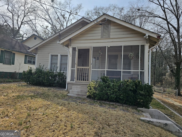 view of front of property with a sunroom