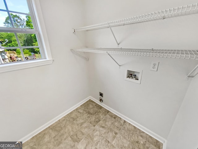 45 Carroll St, Temple, GA 30179 - washroom featuring a wealth of natural light, hookup for an electric dryer, baseboards, washer hookup, and laundry area