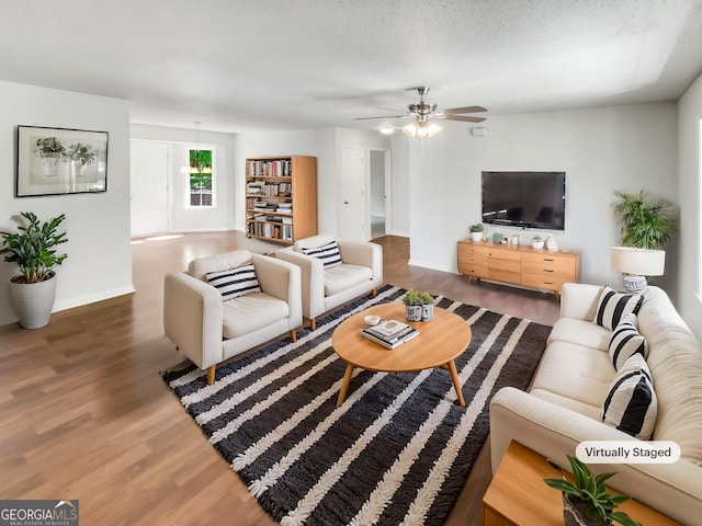 45 Carroll St, Temple, GA 30179 - living room with wood finished floors, a ceiling fan, and baseboards