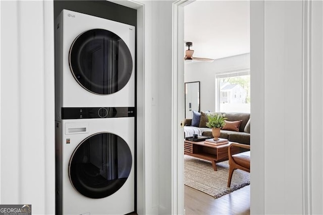 2086 Harold Ave SE, Smyrna, GA 30080 - washroom featuring stacked washer / drying machine and wood finished floors