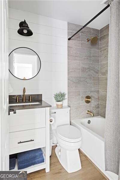 2086 Harold Ave SE, Smyrna, GA 30080 - full bath with toilet, shower / bath combination with curtain, vanity, and wood finished floors