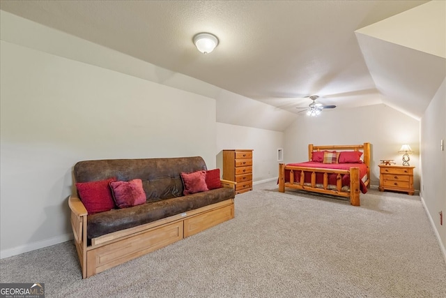 bedroom featuring vaulted ceiling, carpet, baseboards, and ceiling fan
