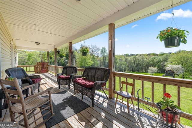 wooden deck with a yard