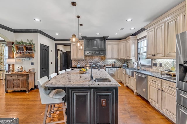 401 Sara Ct, Loganville, GA 30052 - kitchen with cream cabinets, stainless steel appliances, and a sink