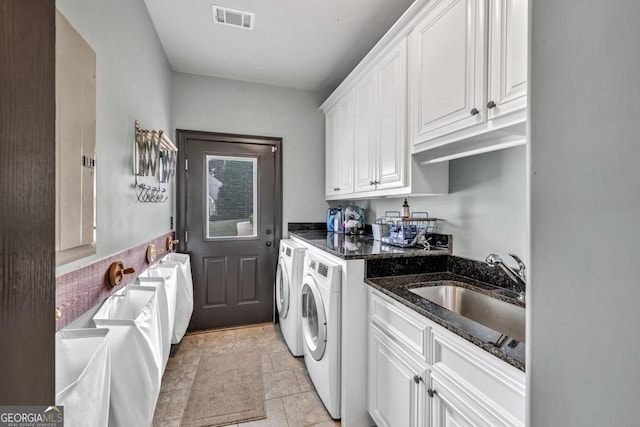 401 Sara Ct, Loganville, GA 30052 - laundry room featuring cabinet space, separate washer and dryer, visible vents, and a sink