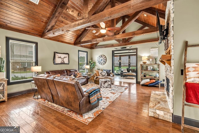 401 Sara Ct, Loganville, GA 30052 - living room with wooden ceiling, baseboards, beamed ceiling, and a wealth of natural light