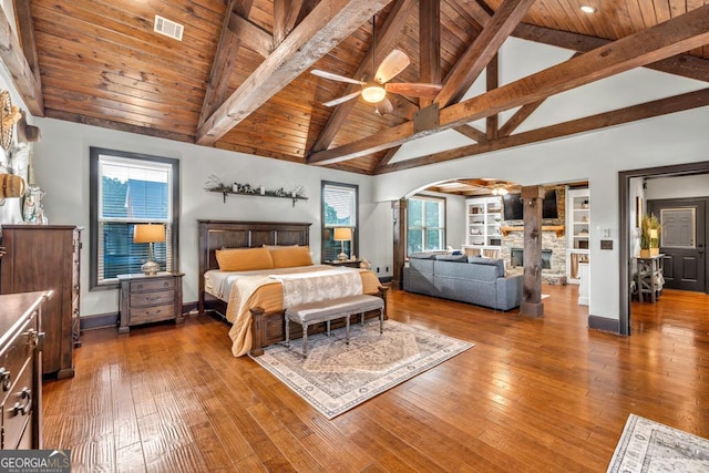401 Sara Ct, Loganville, GA 30052 - bedroom with beamed ceiling, baseboards, ornate columns, wood ceiling, and arched walkways