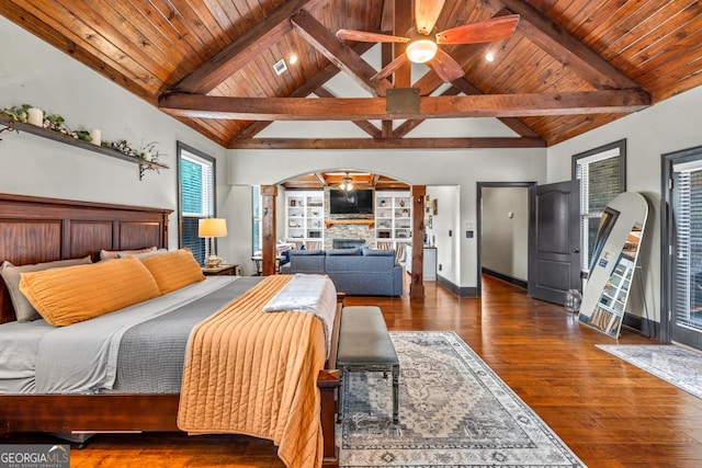 401 Sara Ct, Loganville, GA 30052 - bedroom featuring arched walkways, lofted ceiling with beams, and wood ceiling