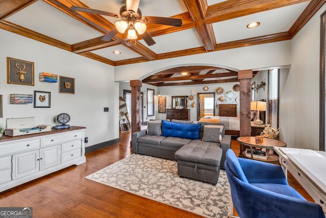 401 Sara Ct, Loganville, GA 30052 - living area featuring ceiling fan, arched walkways, baseboards, ornate columns, and coffered ceiling