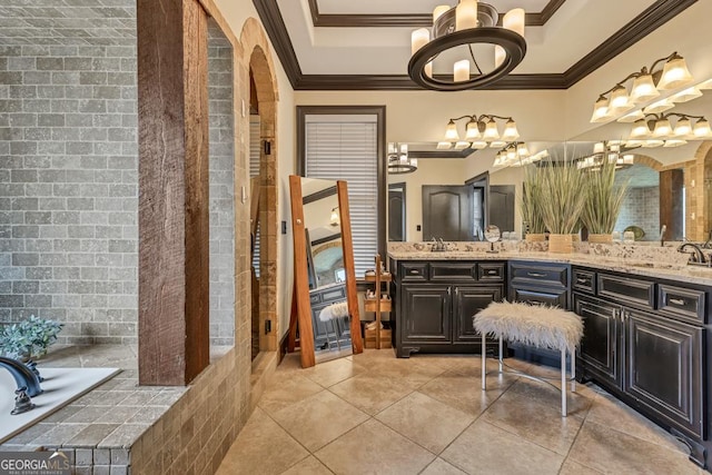 401 Sara Ct, Loganville, GA 30052 - bathroom with an inviting chandelier, ornamental molding, a sink, and tile patterned flooring