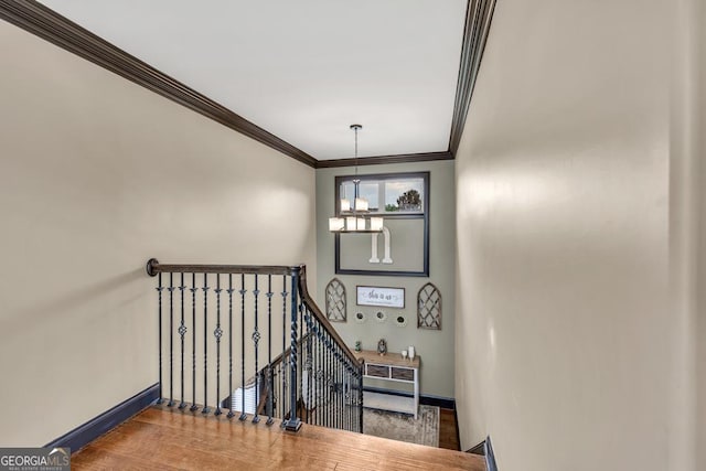 401 Sara Ct, Loganville, GA 30052 - stairs with crown molding, baseboards, and wood finished floors