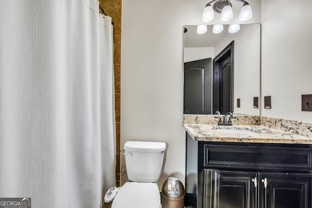 401 Sara Ct, Loganville, GA 30052 - bathroom featuring vanity, curtained shower, and toilet