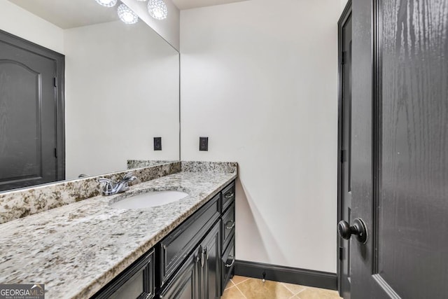 401 Sara Ct, Loganville, GA 30052 - bathroom with baseboards, tile patterned flooring, and vanity