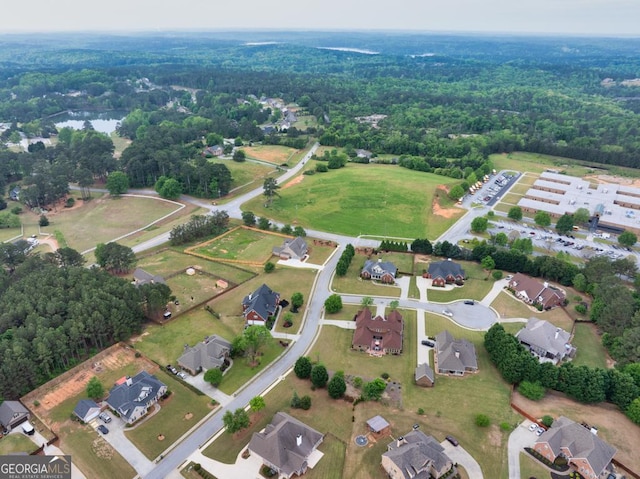 401 Sara Ct, Loganville, GA 30052 - drone / aerial view with a view of trees and a residential view