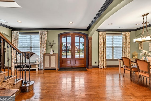 401 Sara Ct, Loganville, GA 30052 - entryway featuring crown molding, hardwood / wood-style flooring, and stairs