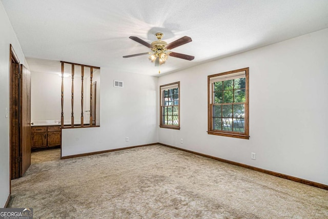 3409 Shorelake Dr, Tucker, GA 30084 - carpeted empty room with baseboards, a ceiling fan, and visible vents