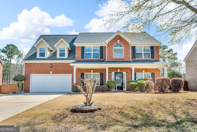 362 Interlake Pass, Mcdonough, GA 30252 - view of front of home featuring driveway, an attached garage, brick siding, and roof with shingles