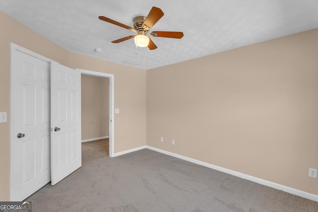 362 Interlake Pass, Mcdonough, GA 30252 - unfurnished bedroom featuring carpet floors, baseboards, and ceiling fan