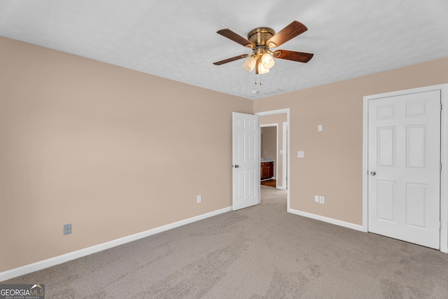 362 Interlake Pass, Mcdonough, GA 30252 - unfurnished bedroom featuring carpet floors, baseboards, and a ceiling fan