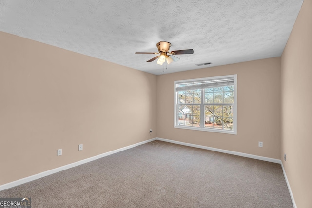 362 Interlake Pass, Mcdonough, GA 30252 - empty room with ceiling fan, a textured ceiling, baseboards, and carpet floors
