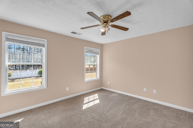 362 Interlake Pass, Mcdonough, GA 30252 - spare room featuring baseboards, carpet, and a ceiling fan