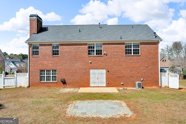 362 Interlake Pass, Mcdonough, GA 30252 - back of property with a patio, a chimney, central AC unit, a shingled roof, and brick siding