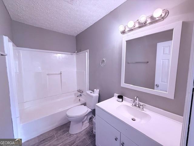 2832 Horseshoe Dr, Macon, GA 31211 - foyer with a textured ceiling, wood finished floors, a ceiling fan, healthy amount of natural light, and baseboards