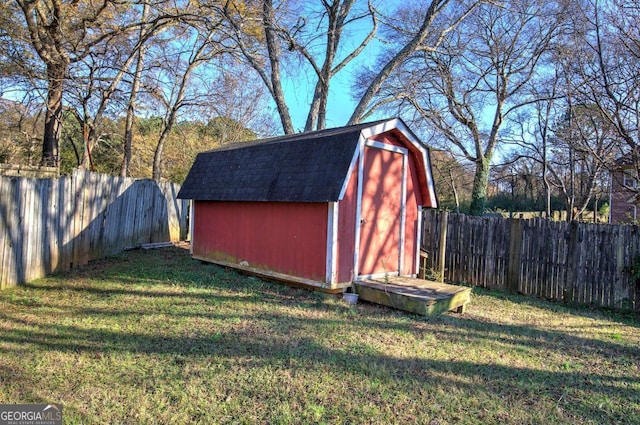 view of shed with a fenced backyard
