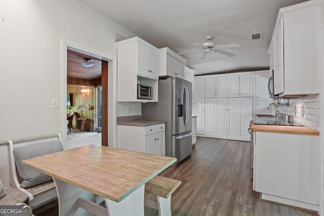 1144 Evergreen Dr NE, Atlanta, GA 30319 - kitchen with white cabinets, visible vents, appliances with stainless steel finishes, and a ceiling fan