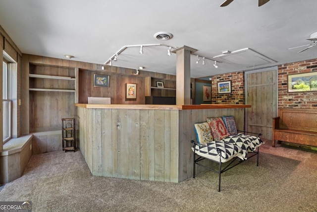1144 Evergreen Dr NE, Atlanta, GA 30319 - interior space with a ceiling fan, a dry bar, carpet, wood walls, and visible vents