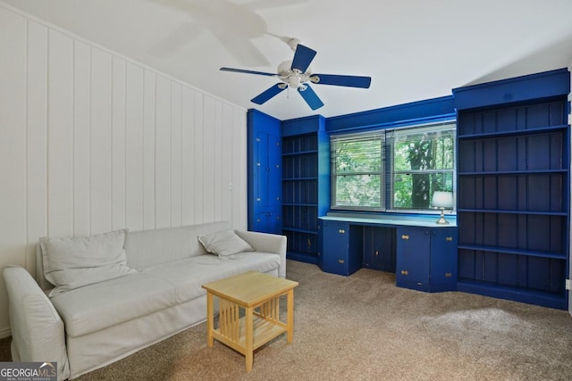 1144 Evergreen Dr NE, Atlanta, GA 30319 - living room with a ceiling fan, built in desk, and light colored carpet