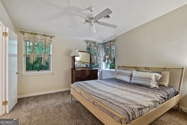 1144 Evergreen Dr NE, Atlanta, GA 30319 - bedroom featuring baseboards, a ceiling fan, multiple windows, and carpet