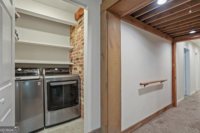 1144 Evergreen Dr NE, Atlanta, GA 30319 - clothes washing area with washer and dryer, light carpet, laundry area, and baseboards