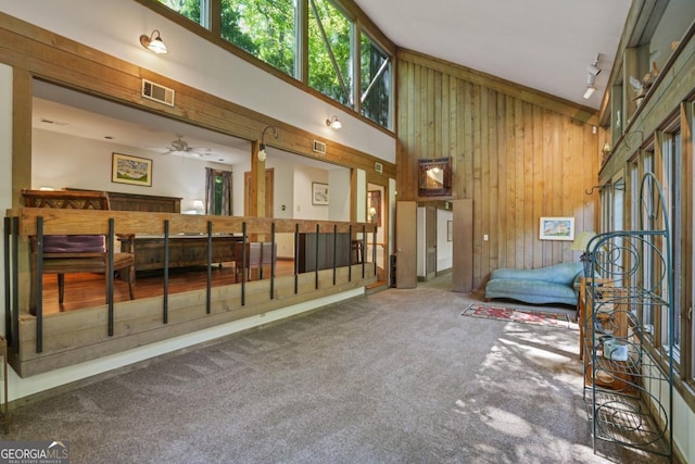 1144 Evergreen Dr NE, Atlanta, GA 30319 - interior space with wood walls, a towering ceiling, and visible vents