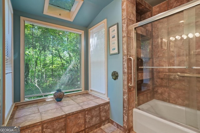 1144 Evergreen Dr NE, Atlanta, GA 30319 - bathroom featuring baseboards, lofted ceiling with skylight, and shower / bath combination with glass door