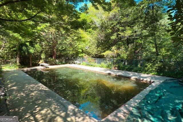 1144 Evergreen Dr NE, Atlanta, GA 30319 - outdoor pool featuring fence and a diving board