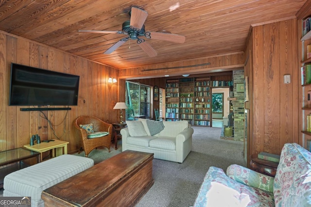 1144 Evergreen Dr NE, Atlanta, GA 30319 - carpeted living room with wood walls, wooden ceiling, and a ceiling fan