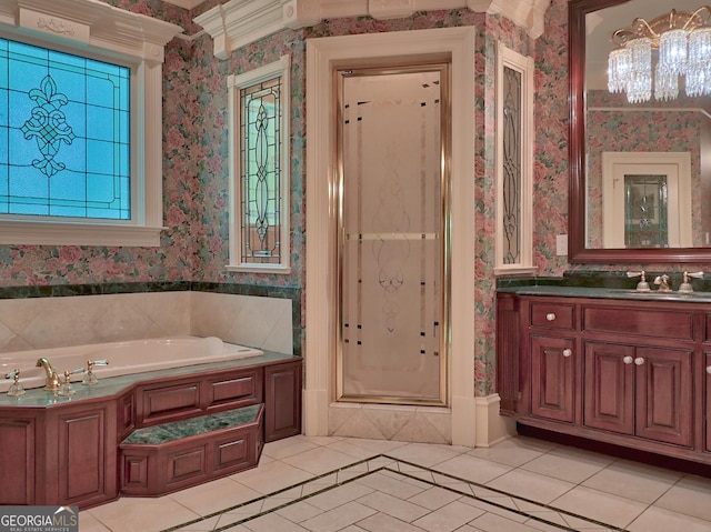 bathroom featuring a bath, tile patterned flooring, wallpapered walls, and a stall shower