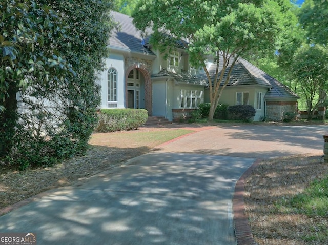 view of front of house featuring driveway and stucco siding